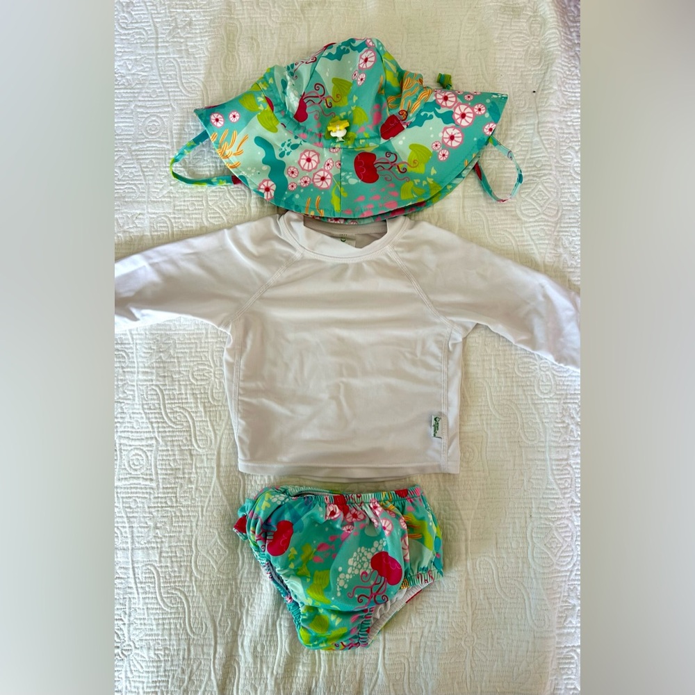 Green sprout rash guard top, swim diaper, and hat set.